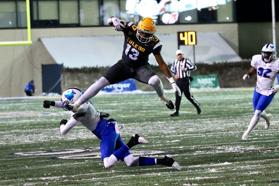 Running back Peny Boone leaping over a defender in Tuesday nights win for the Rockets over Buffalo