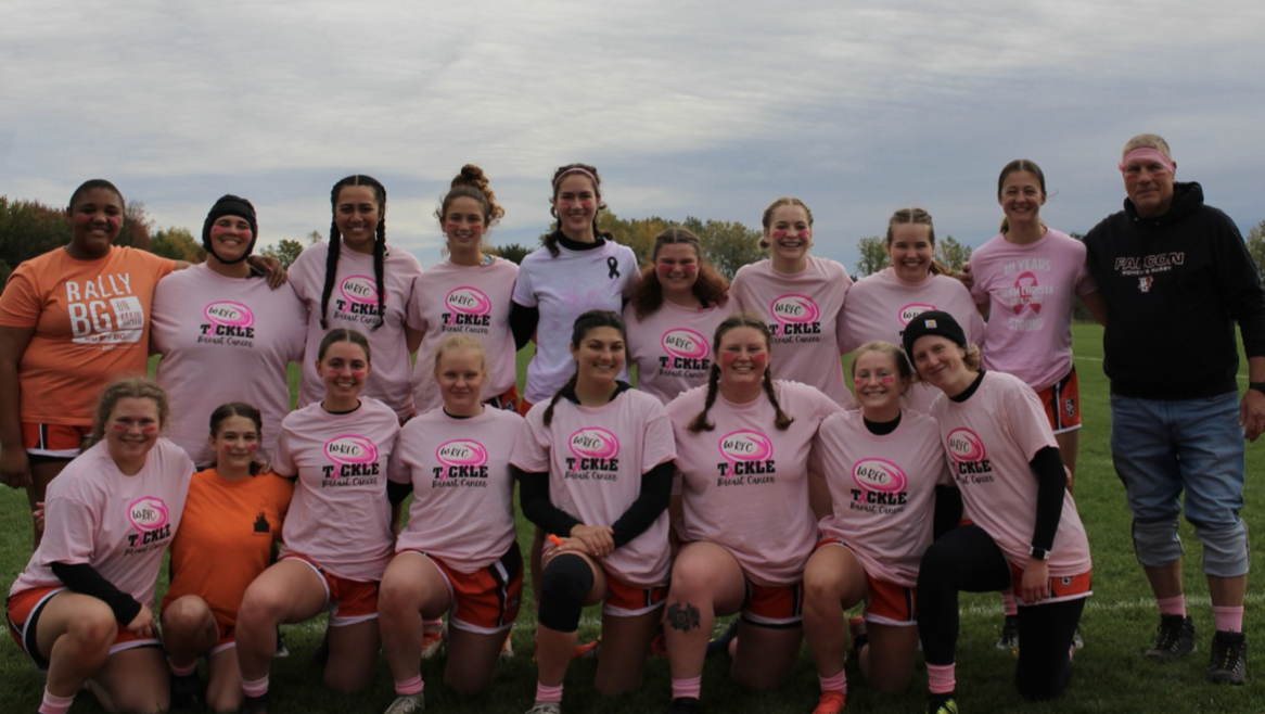 The BGSU women’s rugby team poses together before their first “pink-out” game of the season at Ferris State University in October. Photograph courtesy of Rae Walther. 