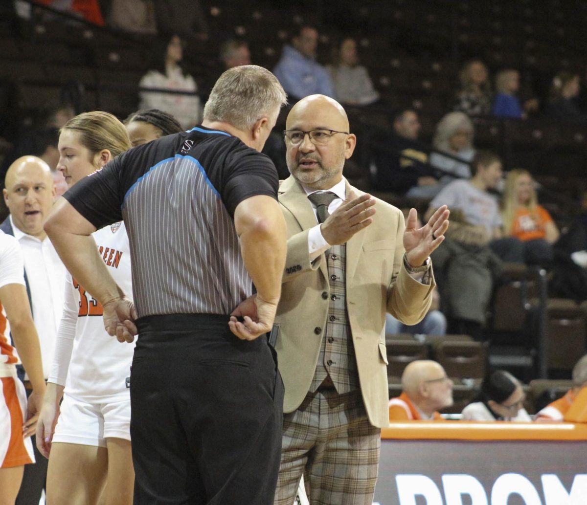 Fred Chmiel talks with the officials about a call