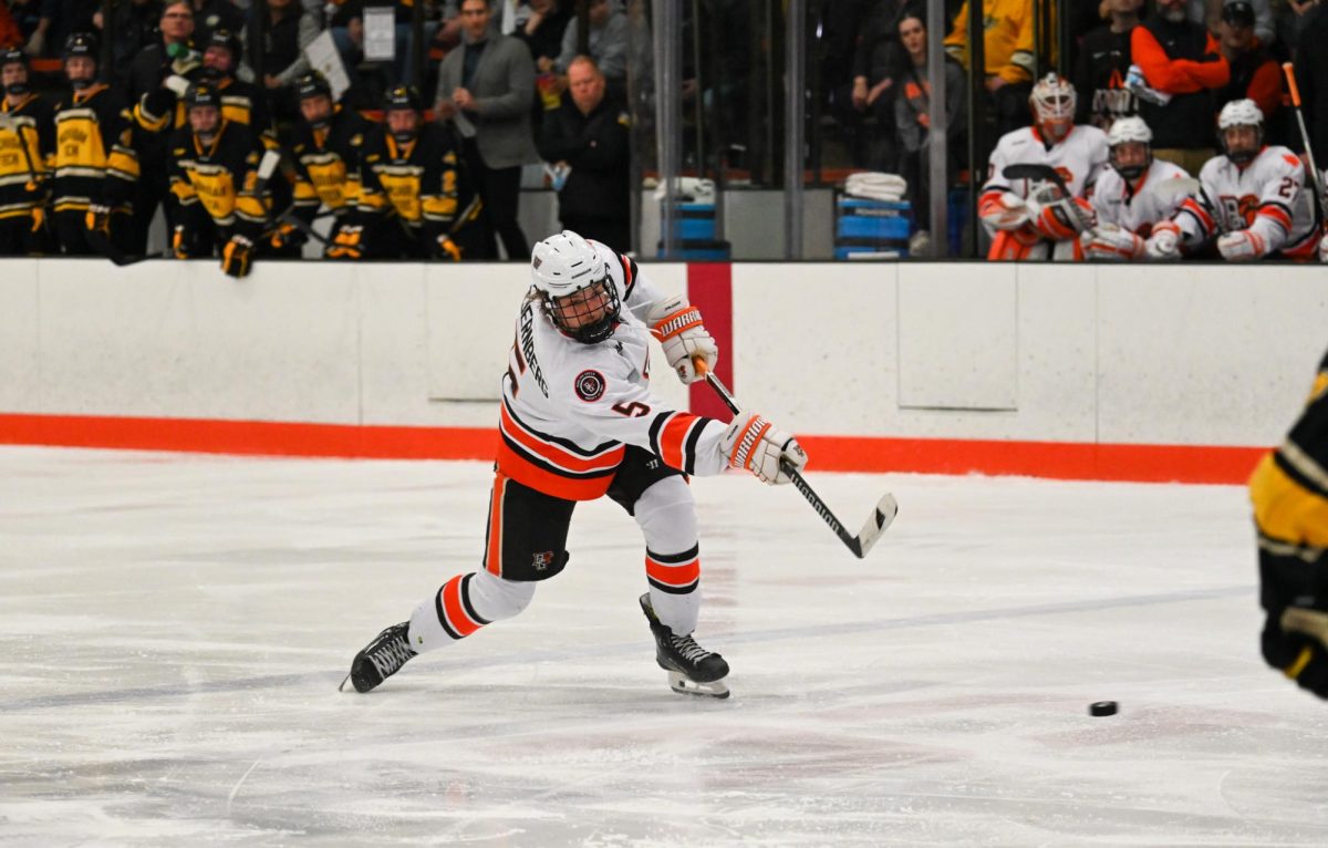 Gustav Stjernberg (5) shooting the puck