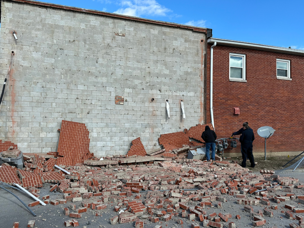 The brick façade falls from the side of a Greenbriar apartment complex in downtown Bowling Green.