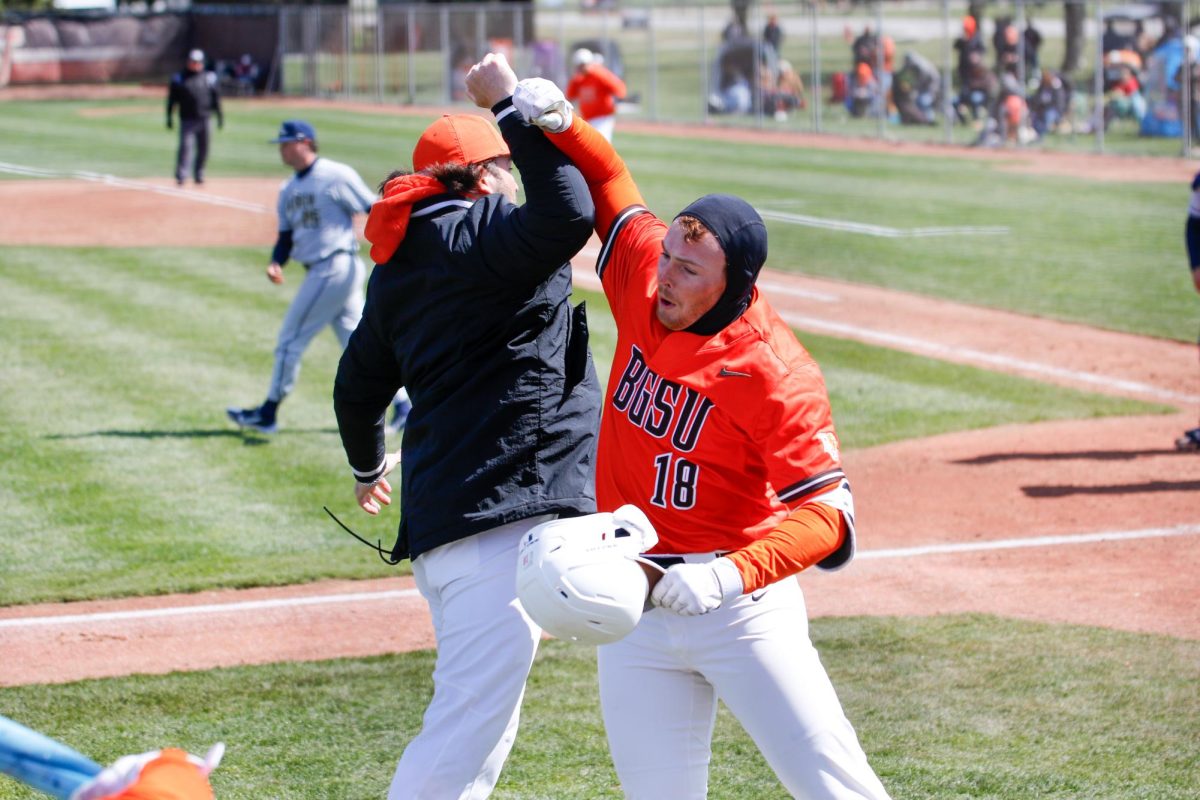 Bowling Green, OH - Falcons Senior Infielder Tyler Ross (18) celebrating his 5th home run of the season at Stellar Field in Bowling Green, Ohio