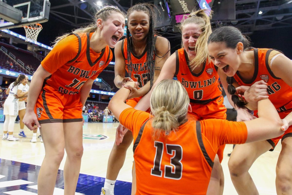 Cleveland%2C+OH+-+BGSU+players+celebrating+a+big+play+from+Falcons+Olivia+Hill+%2813%29+with+lots+of+emotions+and+excitement+at+Rocket+Mortgage+FieldHouse+in+Cleveland%2C+Ohio