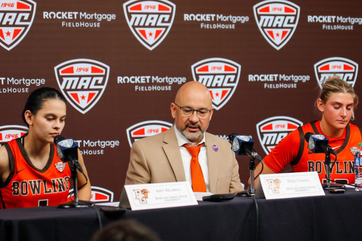 Cleveland, OH - Postgame press conference with Amy Velasco (1), Head Coach Fred Chmiel, and Olivia Hill (13) after a tough 70-64 loss to the Buffalo Bulls looking defeated at Rocket Mortgage FieldHouse in Cleveland, Ohio