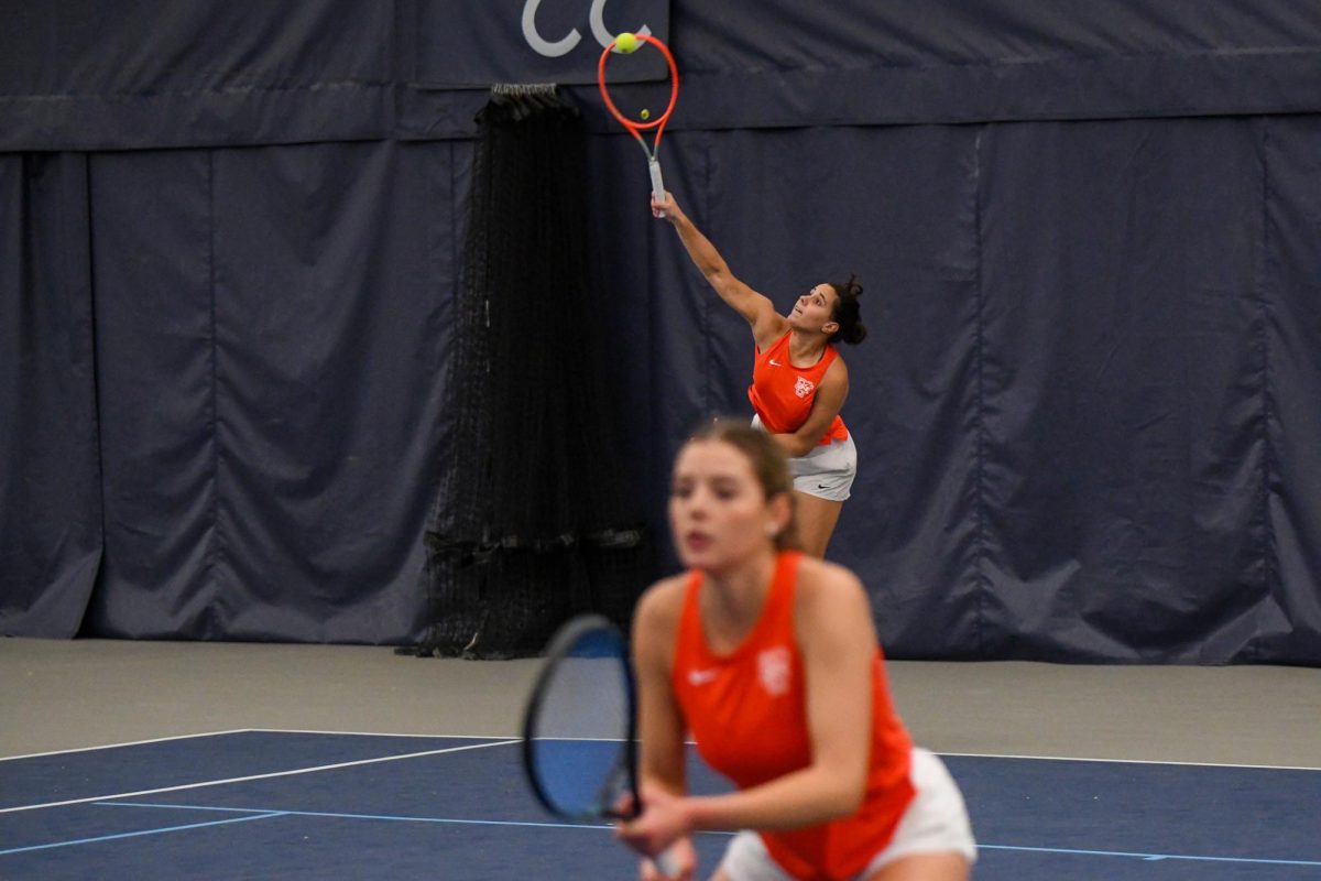 Toledo, OH - Falcons sophomore Leticia Fonseca serving to the Rockets at Twos Athletics Club in Toledo, Ohio