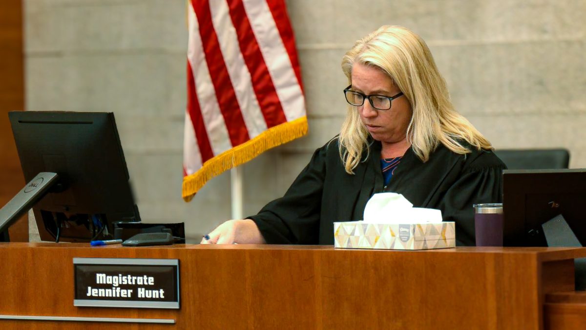 Magistrate Jennifer Hunt analyzing documents at a damages hearing in the hazing death of Stone Foltz. [Feb. 29, 2024]