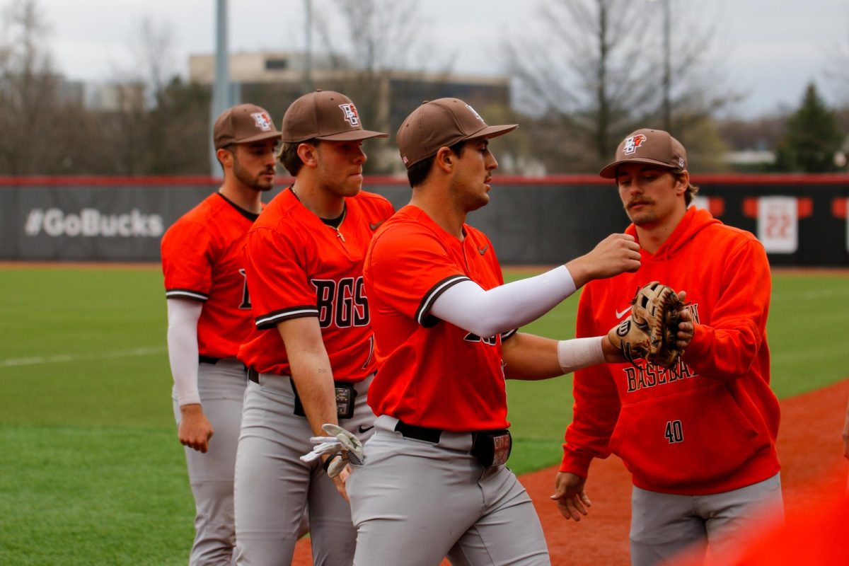 Columbus, OH - Falcons Outfielder Leighton Banjoff (9) celebrating with players after making a catch for an out at Bill Davis Stadium in Columbus, Ohio