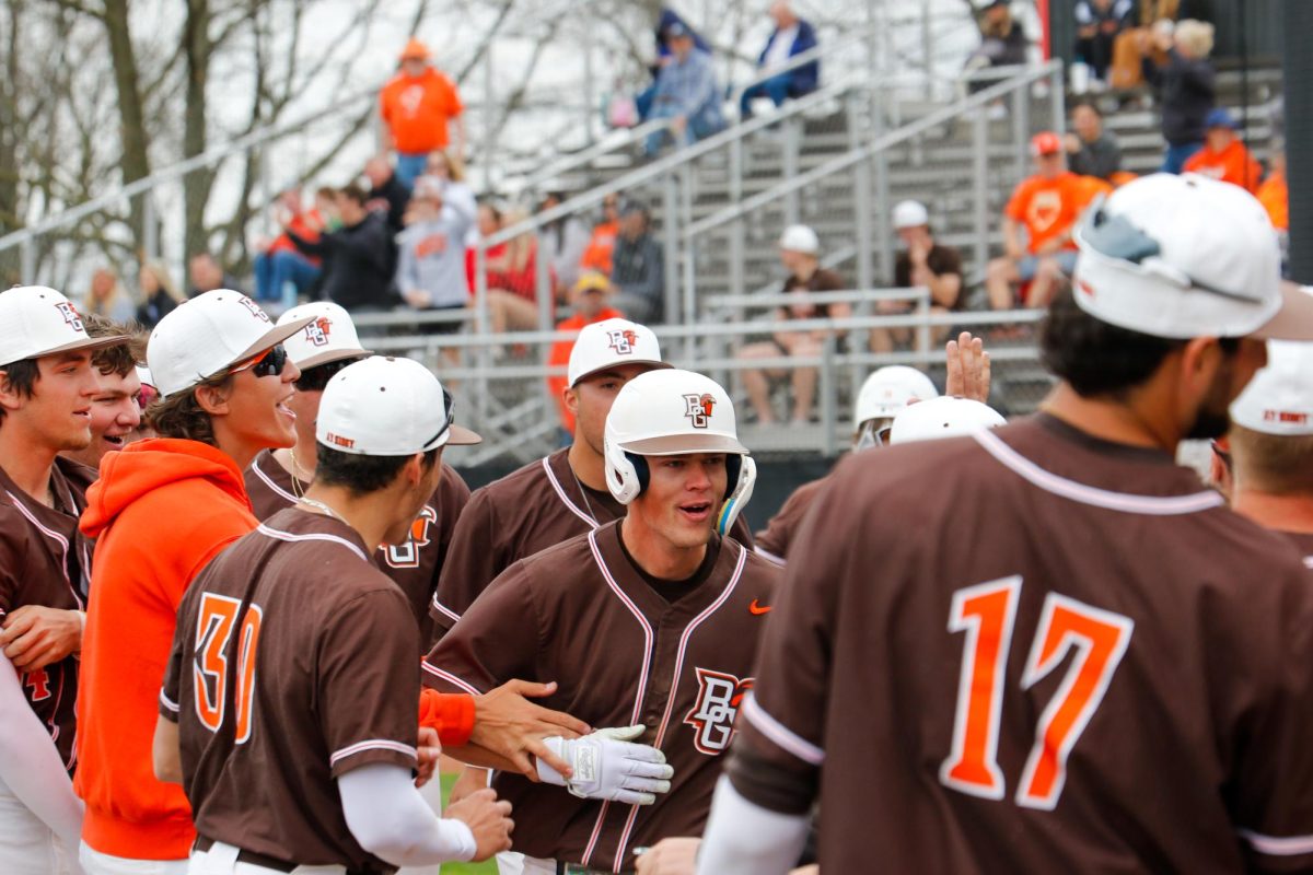 Bowling Green, OH - Falcons Designated Hitter DJ Newman (28) celebrates with teammates after his 3-run homer at Steller Field in Bowling Green, Ohio 