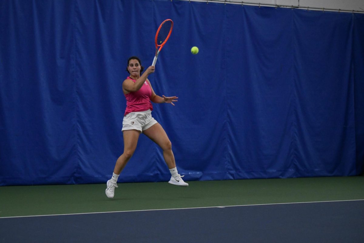 Perrysburg, OH - Falcons Leticia Fonseca returning a serve from the  Cardinals at Perrysburg Tennis Center