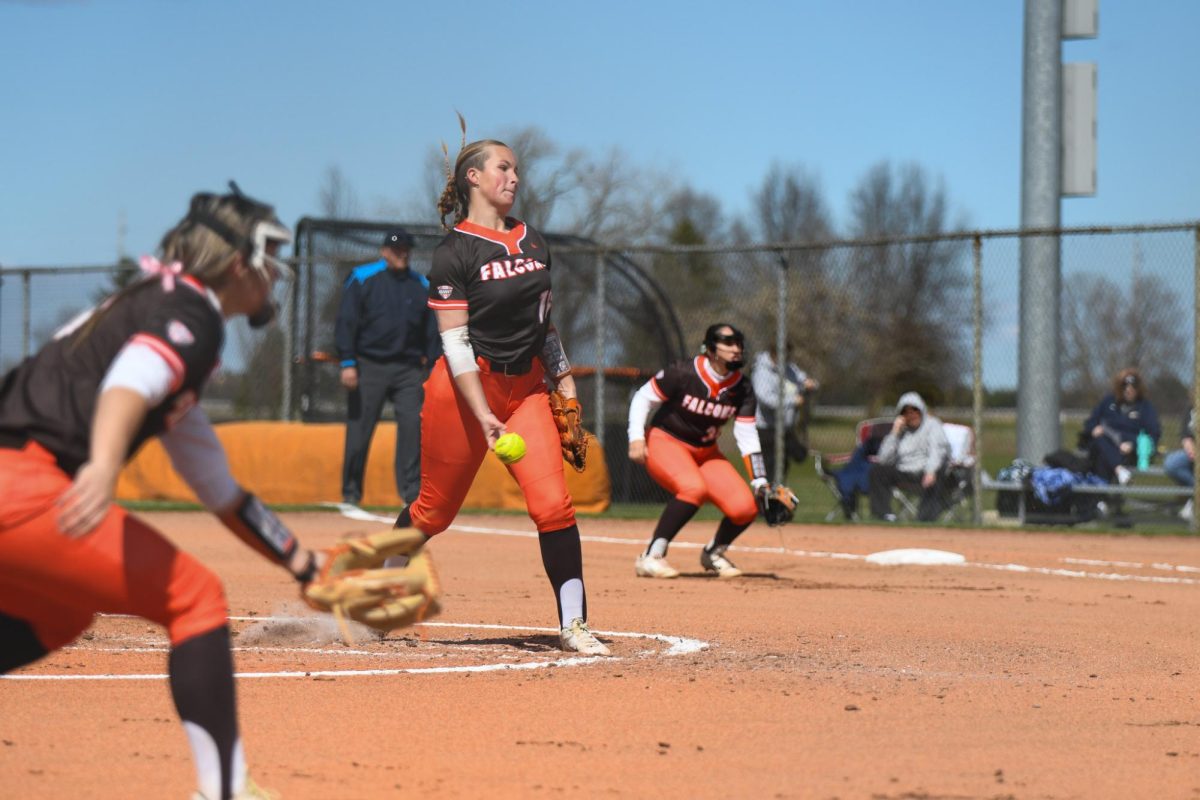 Bowling Green, OH - Falcons freshman pitcher Emma Dennison (16) pitching to a Zips batter with her infield at the ready at Meserve Field in Bowling Green, Ohio