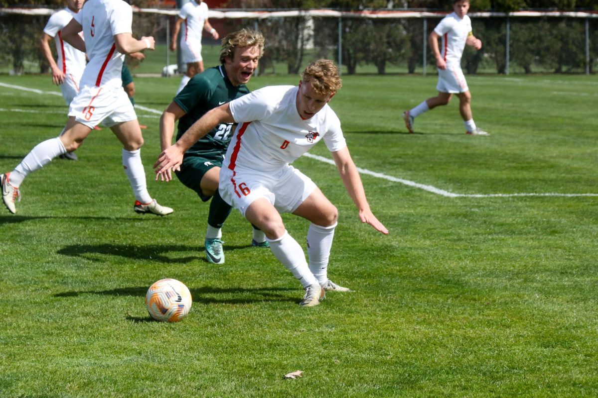 Bowling Green, OH - Falcons Forward Senior Taylor Dyson (6) fighting for the ball at Cochrane Soccer Field in Bowling Green, Ohio