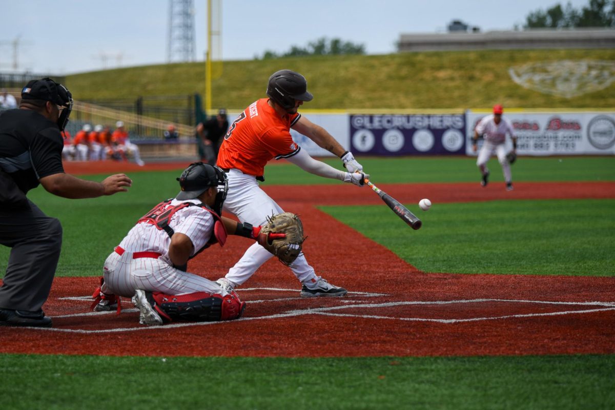 Avon, OH - Falcons freshman catcher Garrett Wright (3) driving the ball at Crushers Stadium in Avon, Ohio