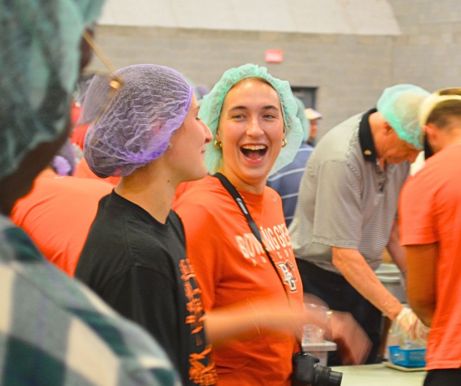 Plenty of laughs and smiles could be found while packaging up meals at the Perry Field House.