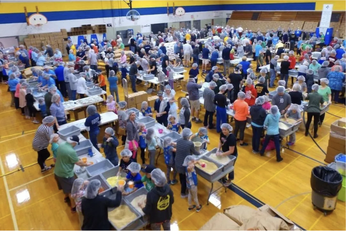 About 400 volunteers are needed to help package meals on July 26 at the Perry Field House.