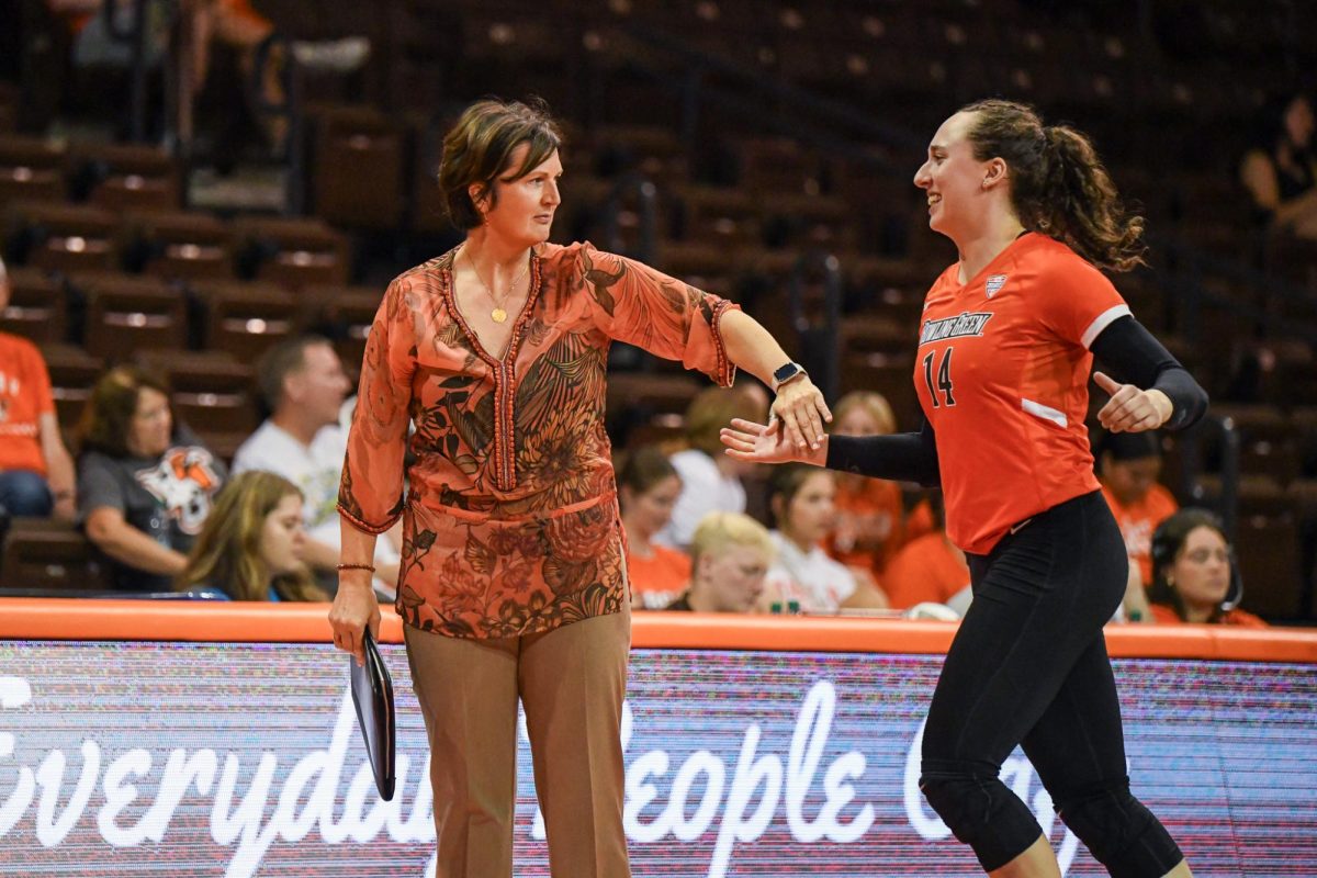 Bowling Green, OH - Falcons head coach Danijela Tomic talking with her junior opposite hitter Lauryn Hovey (14) during a time out at Stroh Center in Bowling Green Ohio