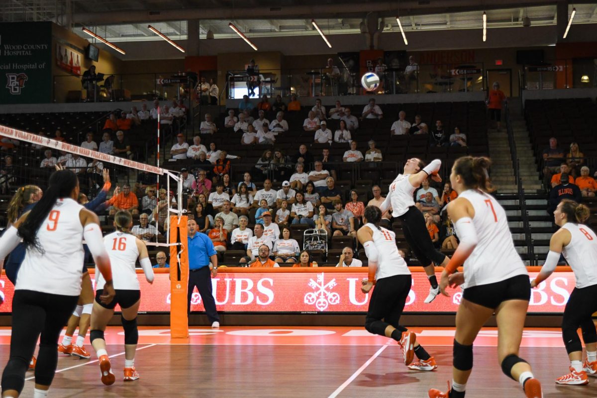 Bowling Green, OH - Falcons junior opposite Lauryn Hovey (14) hitting a line shot through the Illini blockers at Stroh Center in Bowling Green, Ohio.