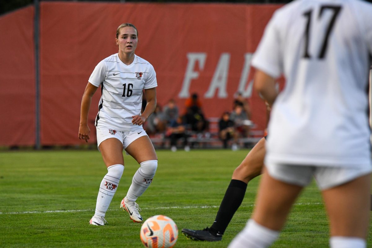 Bowling Green, Ohio - Falcons freshman defender Kaley Simqu (16) advancing the ball to her midfielders at Cochrane Field, Bowling Green