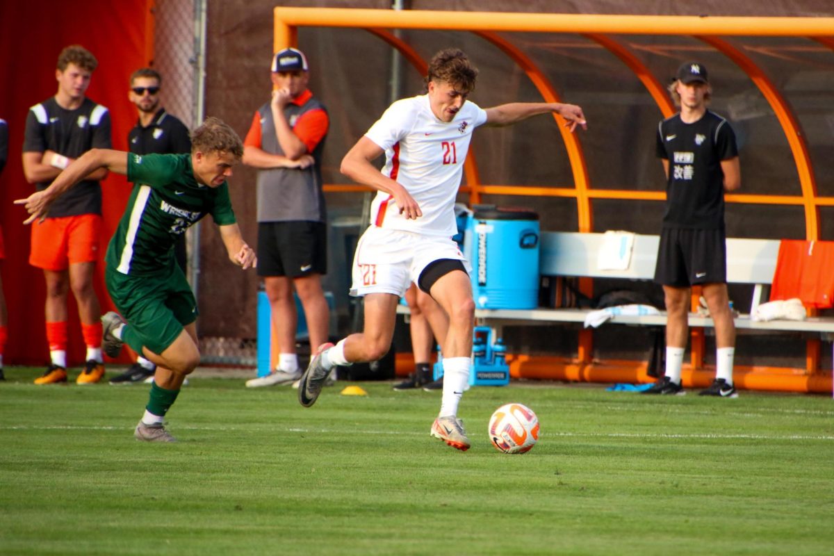 Bowling Green, Ohio – Falcons Junior Forward Trace Terry (21) advancing the ball away from Wright State at Cochrane Field at Bowling Green