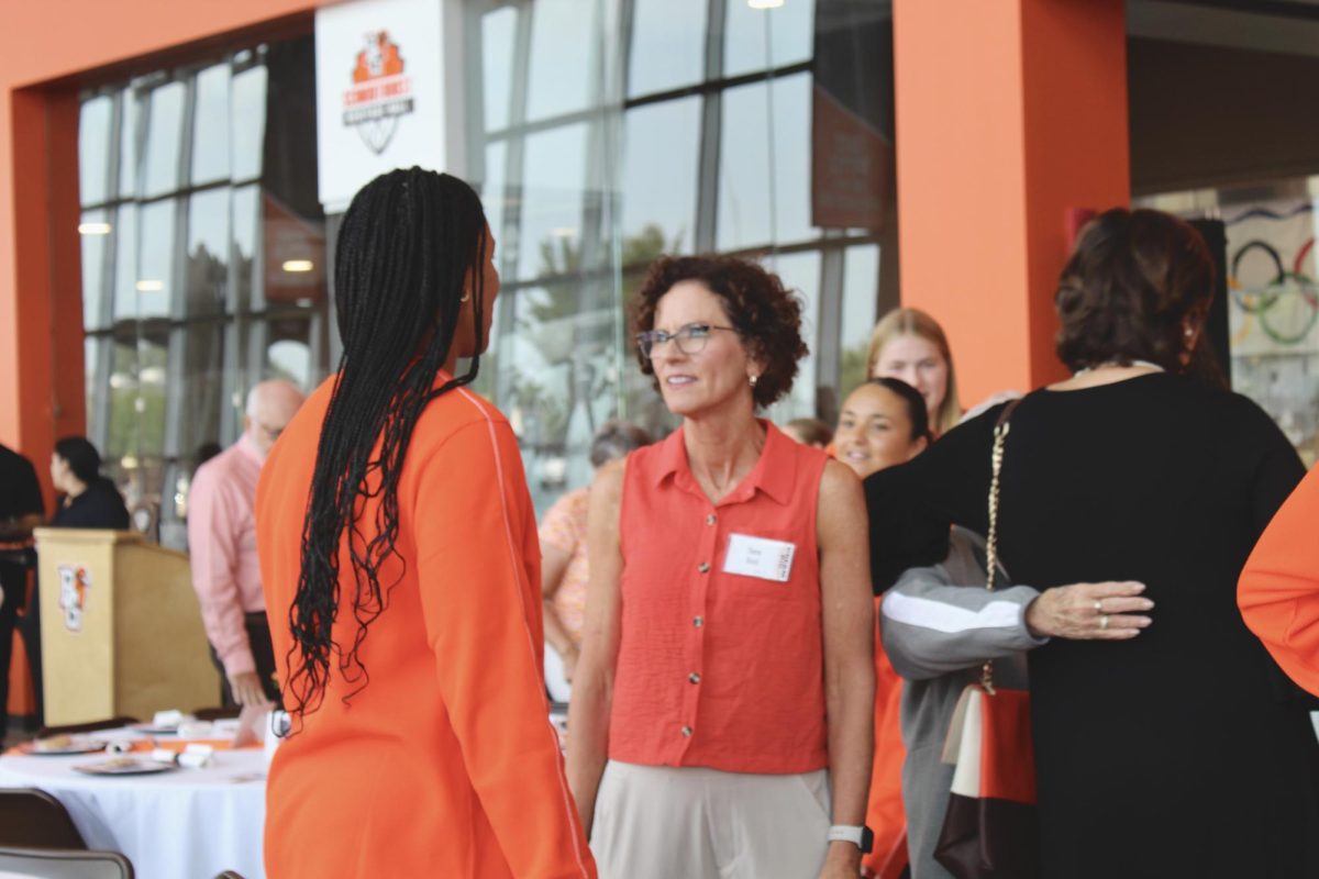 BGSU volleyball players mingling with guests