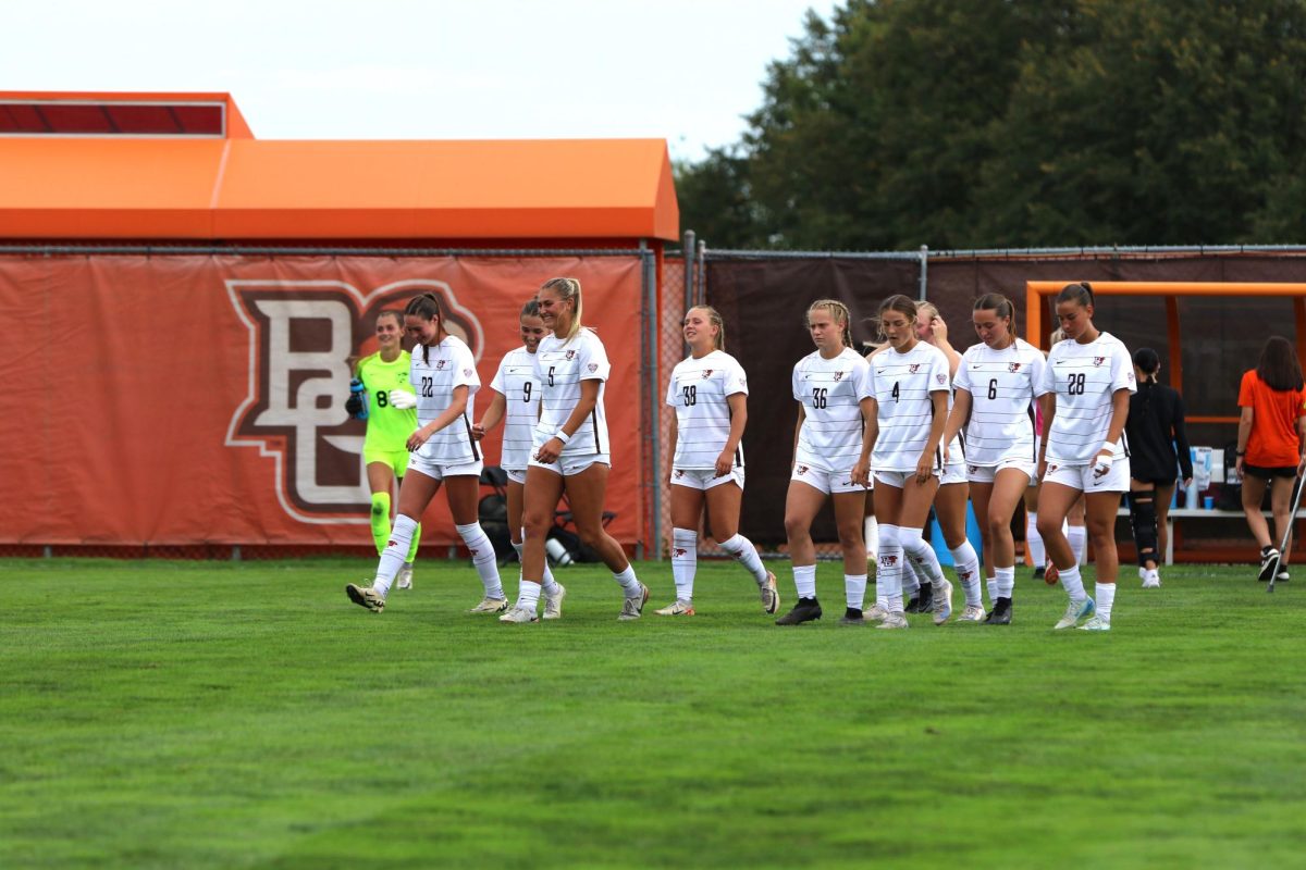 Bowling Green, OH - Falcons entering the field prepared to take on the Rockets at Cochrane Stadium in Bowling Green, Ohio