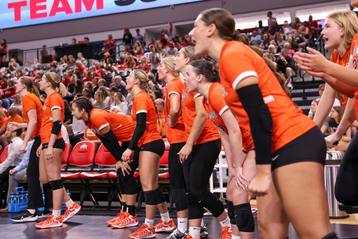 Columbus, OH - The falcons bench cheers on their teammates during a contest against the Buckeyes in Covelli Center in Columbus, Ohio.