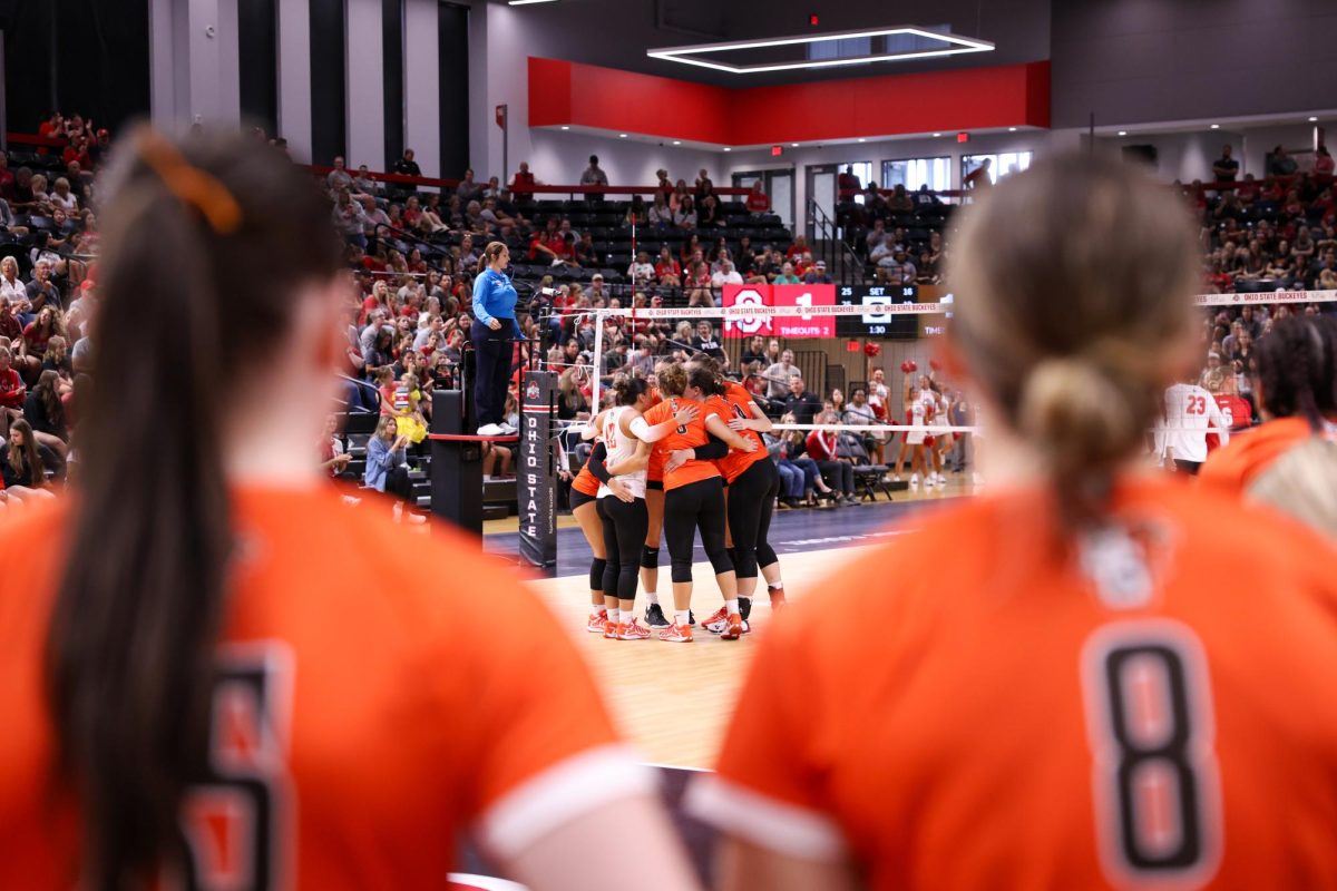 Columbus, OH - The falcon volleyball team huddles on the court after scoring a point against the Buckeyes at the Covelli Center in Columbus, Ohio.