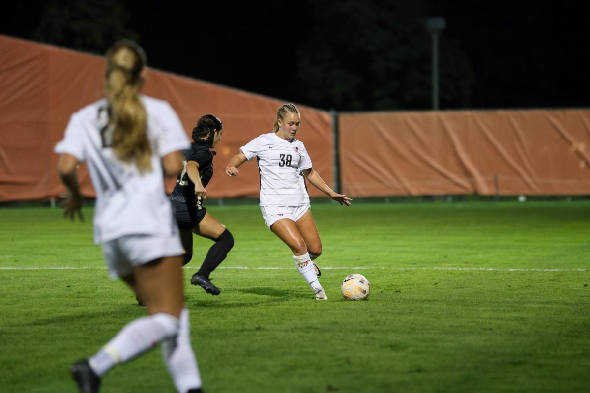 Bowling Green OH - Falcons Sophomore Defender Christine Erdman (38) prepares to pass the ball to a 
teammate during the closing minutes of a contest against Oakland University at Cochrane Stadium in Bowling Green, Ohio.