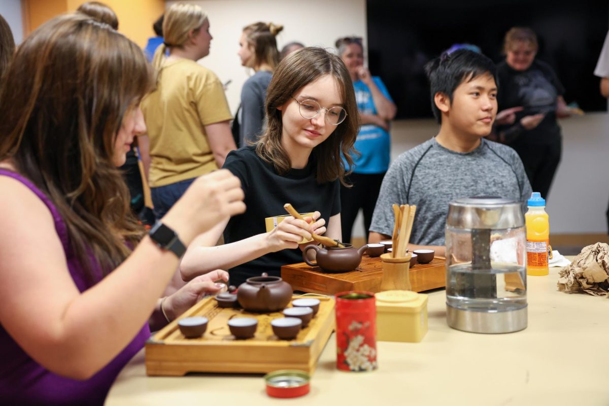 Emma Bray serving Kungfu tea at the Mid-Autumn Festival