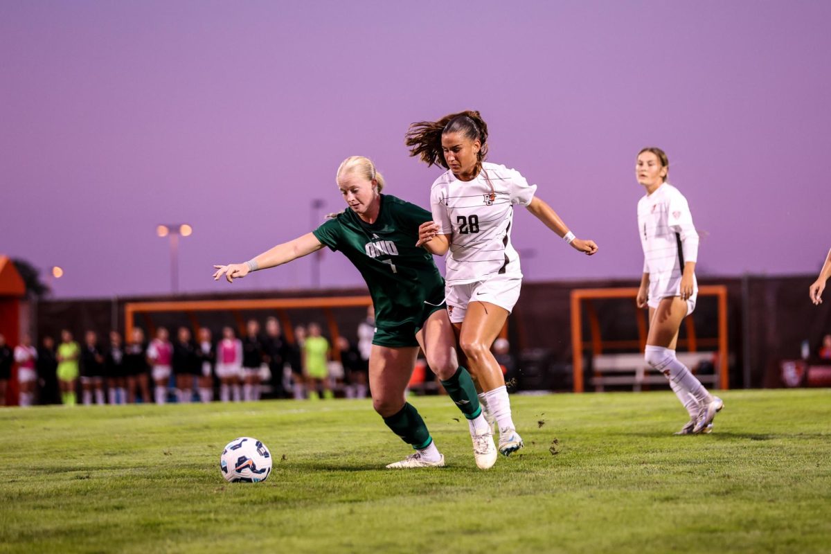 Bowling Green, OH - Falcons Midfield sophomore Michelle Hochstadt (28) overtakes an Ohio University player for the ball at Cochrane Stadium in Bowling Green, Ohio.