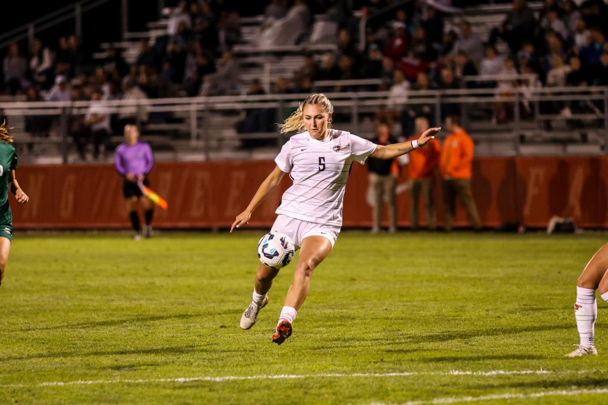 Bowling Green, OH - Falcons Bowling Green Graduate student midfielder Lexi Czerwien (5) kicks the ball during a match against Ohio University at Cochrane Stadium in Bowling Green, Ohio.