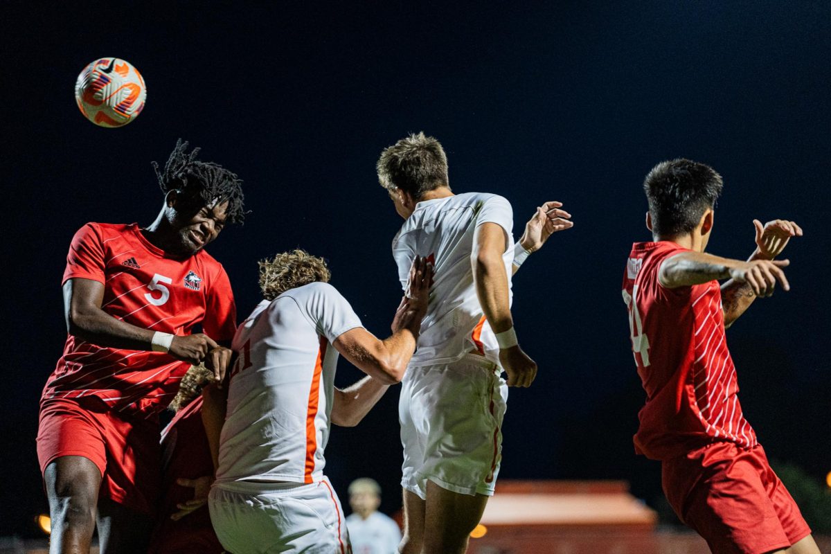 Bowling Green OH - Two Falcons battle two Husky defenders to attempt to score a goal off of a corner kick in the second half at Cochrane Stadium in Bowling Green, Ohio.