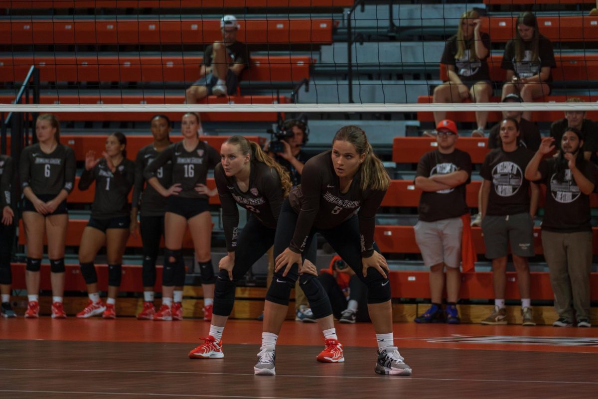 Bowling Green, OH - Falcons sophomore defensive specialist Isabelle Laube (2) and freshman setter Anna Sitek (5) wait for the Bearcat’s serve at the Stroh Center in Bowling Green, Ohio.