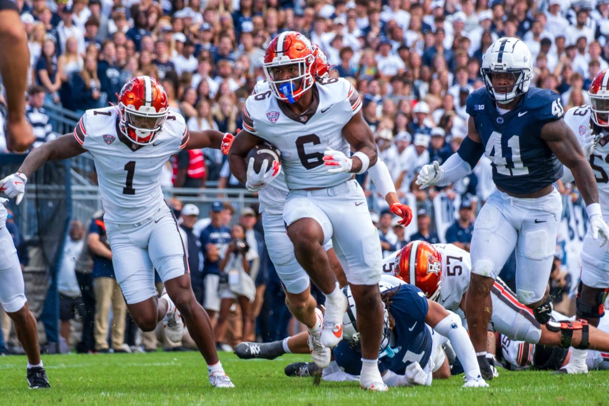 University Park, PA - Falcons senior running back Jamal Johnson (6) breaks through the Nittany Lions defense for a 41-yard touchdown at Beaver Stadium in University Park, Pennsylvania.