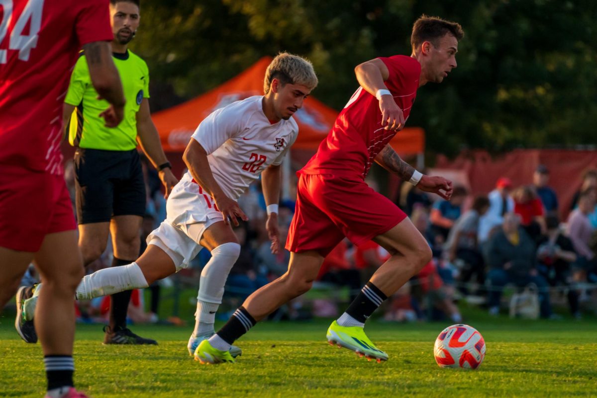 Bowling Green, OH - Falcons sophomore midfielder Anthony Hernandez (22) attempting to take the ball from Huskies defender at Cochrane Stadium in Bowling Green, Ohio.