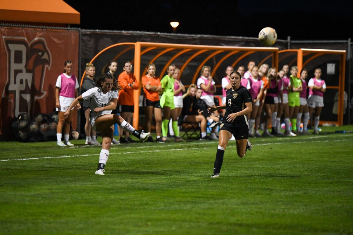 Bowling Green OH - Falcons sophomore midfielder Jaden Frigerio (11) passing into the box for an opportunity at a goal at Cochrane Stadium in Bowling Green, Ohio.