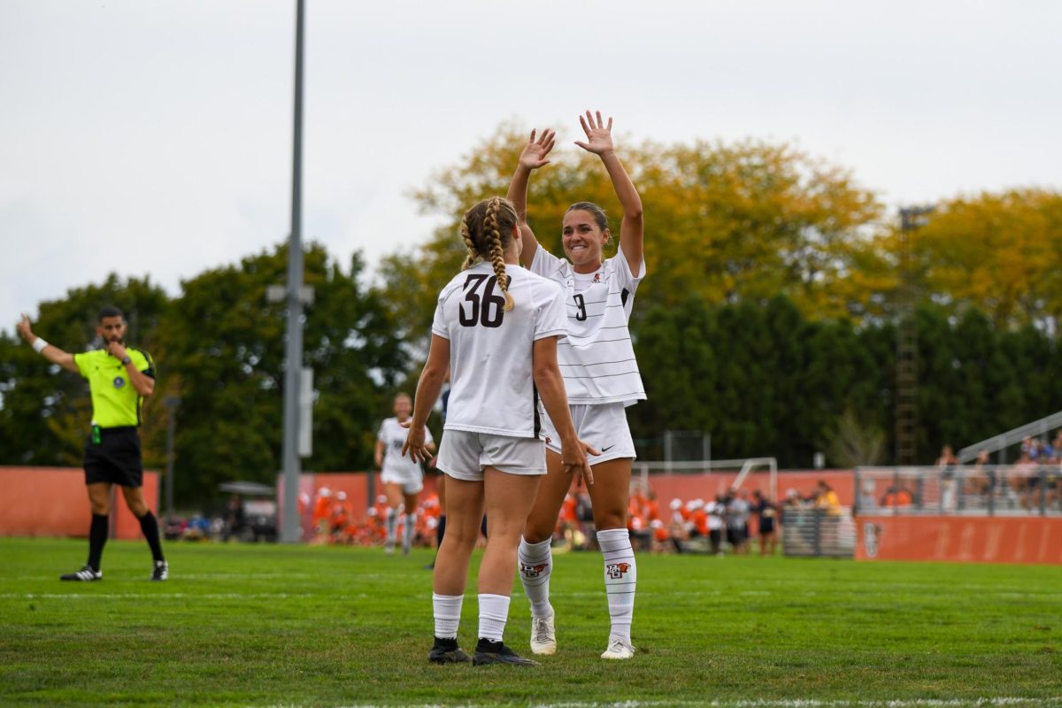 Bowling Green, OH - Falcons sophomore forward Emma Stransky (36) and junior forward Brynn Gardner (9) celebrating after the Falcons score their second goal to take the lead late in the game at Cochrane Stadium in Bowling Green, Ohio