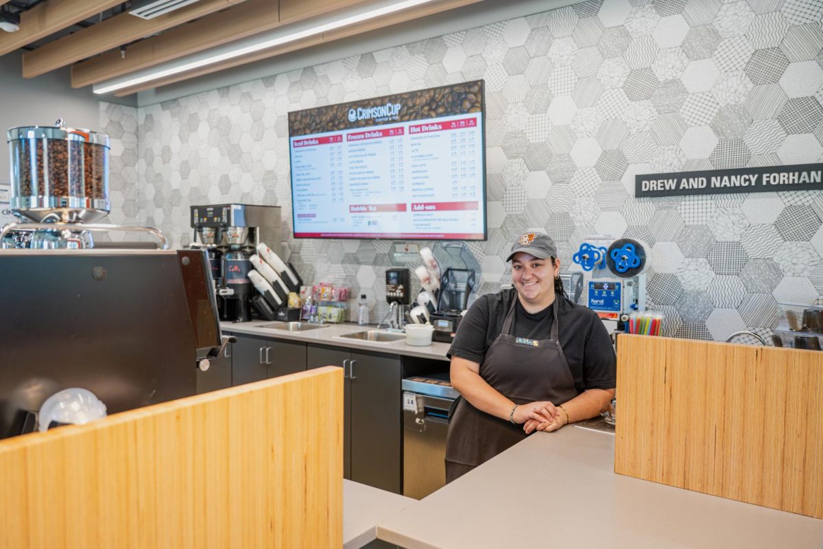 Kayla Hall, a Forhan’s Cafe employee and senior film production major poses for a photo on Sept. 3, 2024.