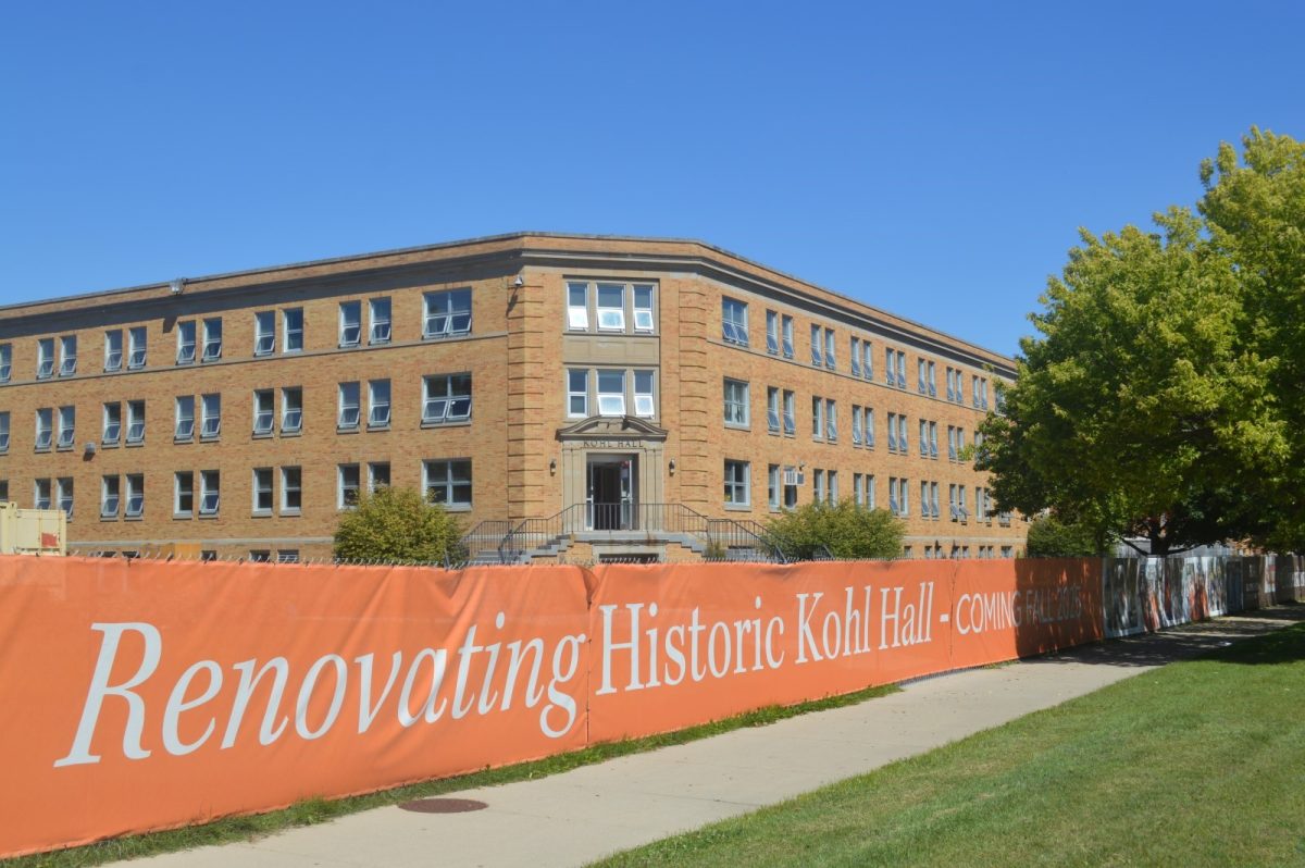 The renovating fence outside of Kohl Hall