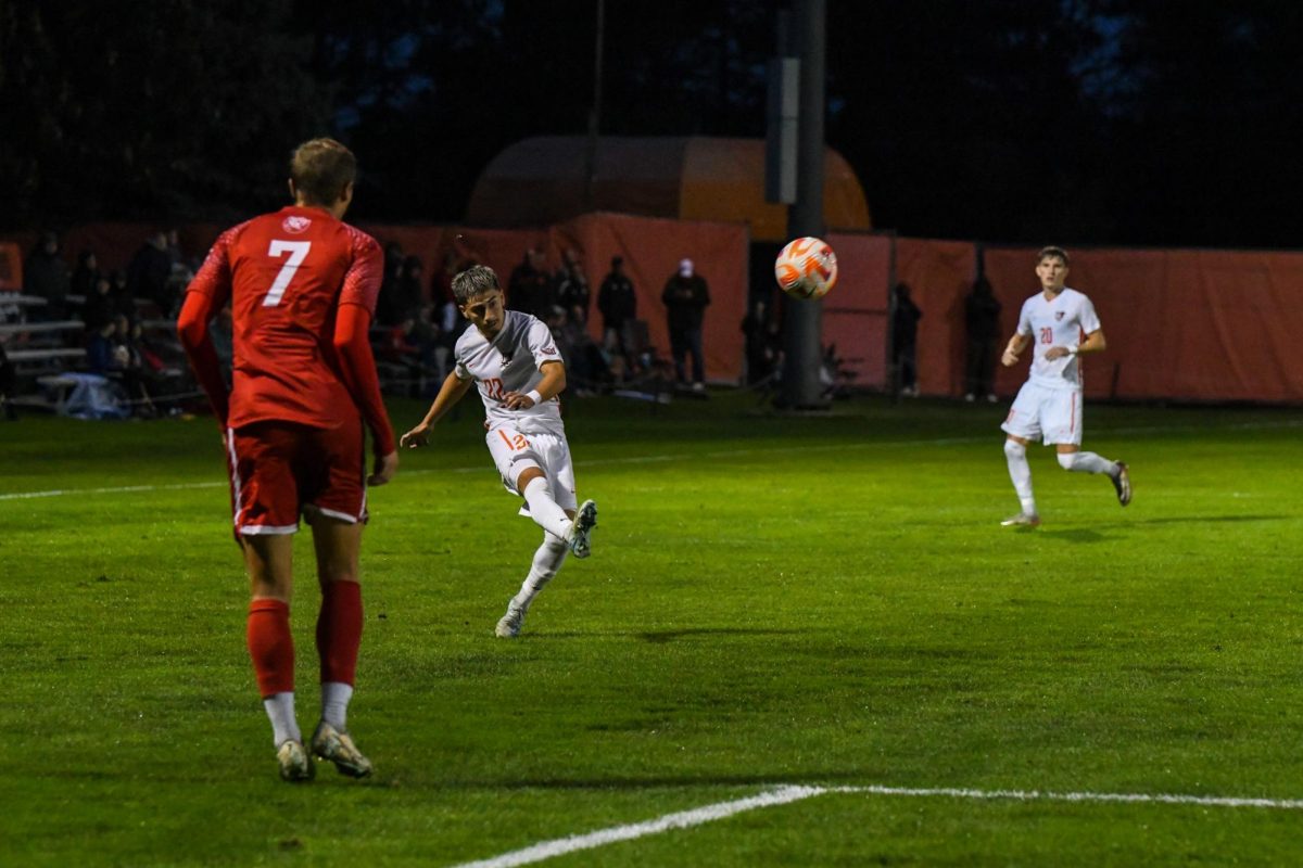 Bowling Green, OH - Falcons sophomore midfielder Anthony Hernandez (22) passing inside past the Bruins defense at Cochrane Stadium in Bowling Green, Ohio.