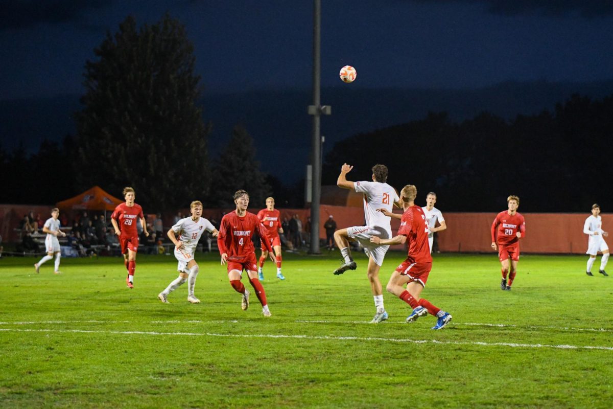 Bowling Green, OH - Falcons junior forward Trace Terry (21) going up with the Bruins to contest a header at Cochrane Stadium in Bowling Green, Ohio.