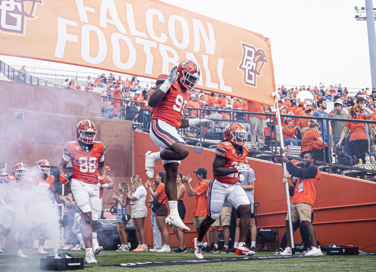 Bowling Green, OH - Falcons run out on the field for kick-off at Doyt L. Perry Stadium in Bowling Green, Ohio.