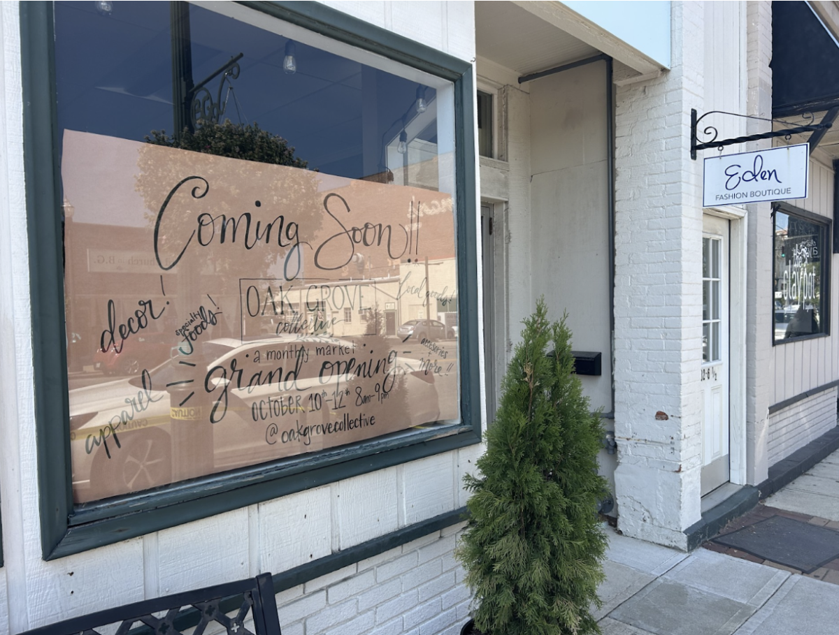 The "coming soon" sign posted in Eden's front window anticipating the opening of the Oak Grove Collective