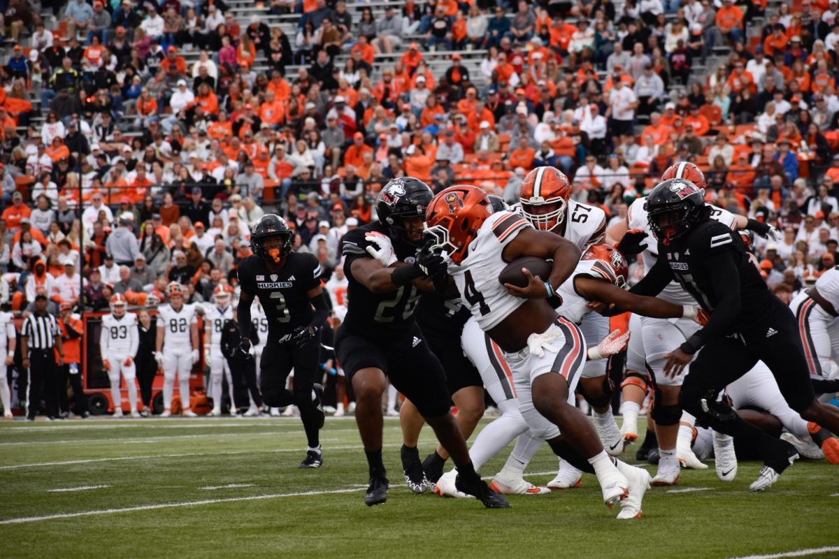 Bowling Green, OH - Falcons junior running back Terion Stewart (4) pushing his way through the Huskies defense at Doyt L. Perry Stadium in Bowling Green, Ohio.