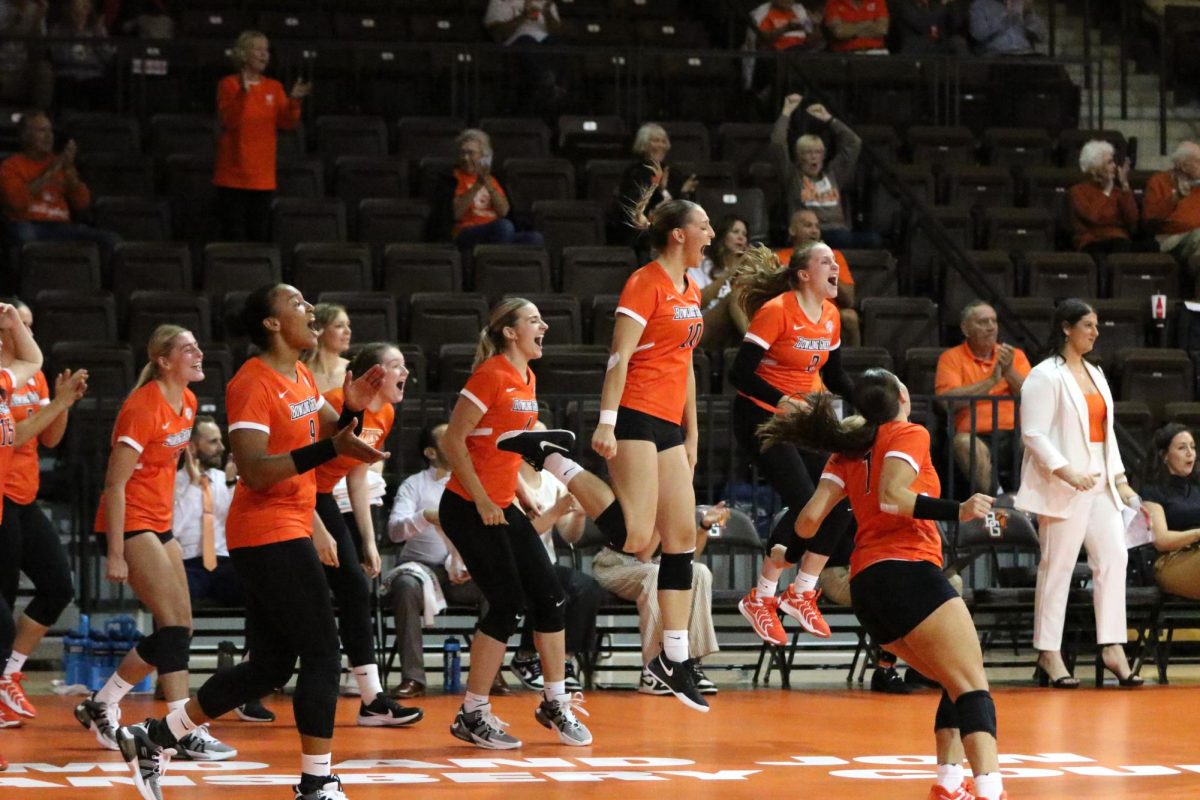 Bowling Green, OH- The BGSU bench celebrates in the last set of the game for the win against Western Michigan at the Stroh Center in Bowling Green, Ohio.