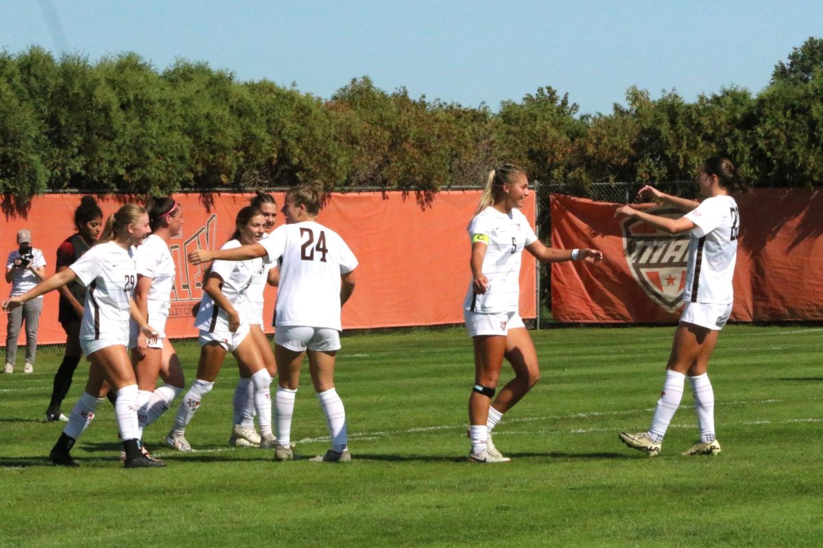 Bowling Green, OH - The team celebrates after their second goal by graduate Defender Lexi Czerwien (5) at Cochrane Stadium in Bowling Green, Ohio.