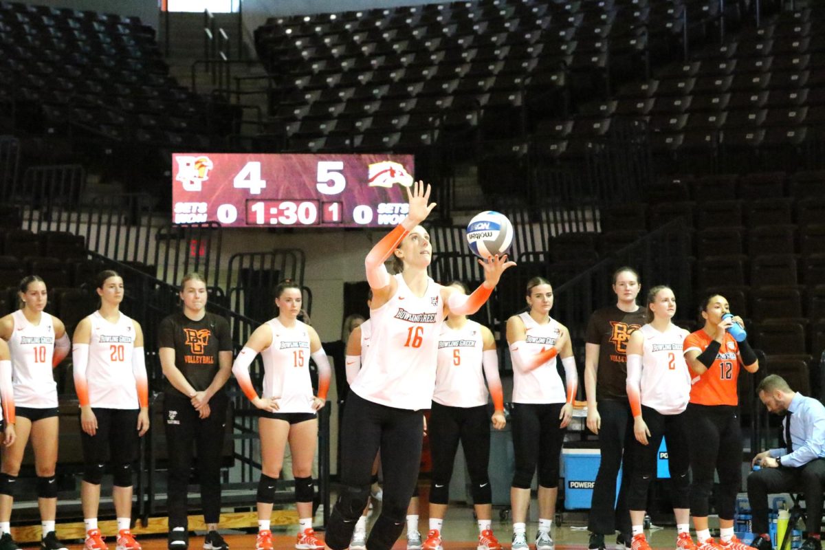 Bowling Green, OH - Falcons 5th year Middle Blocker Alexis Mettille (16) going up for a serve against Western Michigan at the Stroh Center in Bowling Green, Ohio.