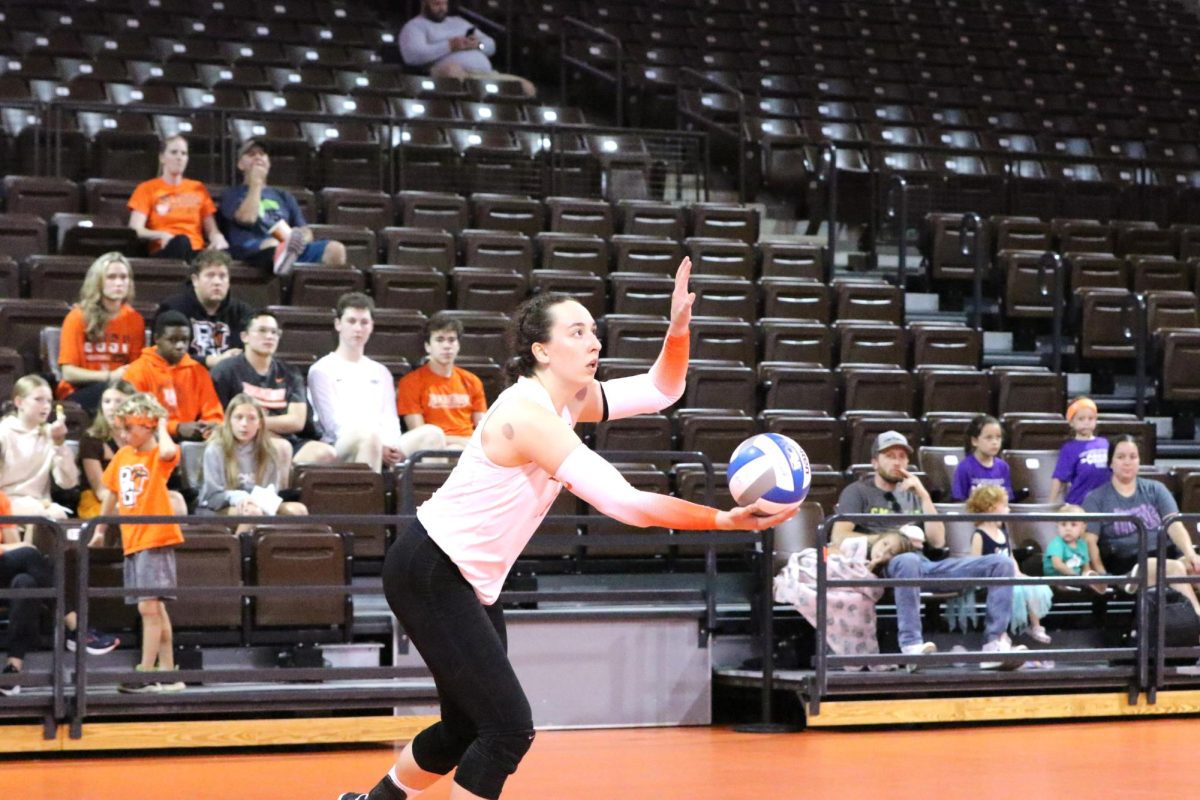 Bowling Green, OH - Falcons junior Opposite Hitter Lauryn Hovey (14) goes up for a serve during the third set against Western Michigan at the Stroh Center in Bowling Green, Ohio.