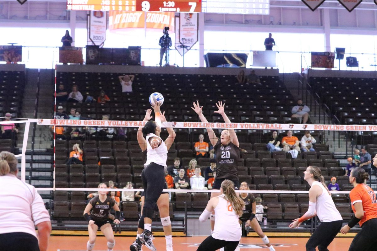 Bowling Green, OH - Falcons Senior Outside Hitter Mia Tyler (9) goes up to get another point to start taking a big lead against Western Michigan at the Stroh Center in Bowling Green, Ohio.