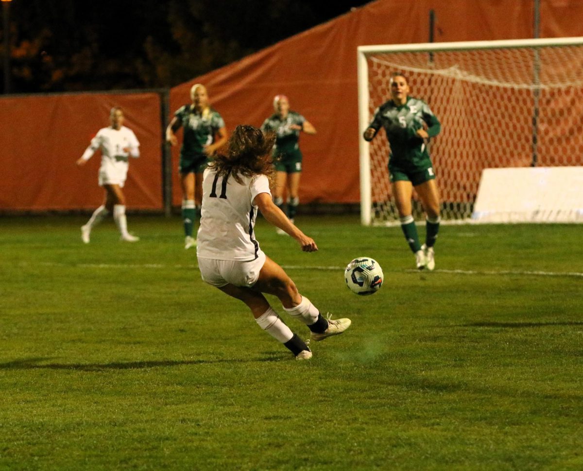 Bowling Green, OH - Falcons senior midfielder Jaden Frigerio (11) putting up a shot on goal at Cochrane Stadium in Bowling Green, Ohio.