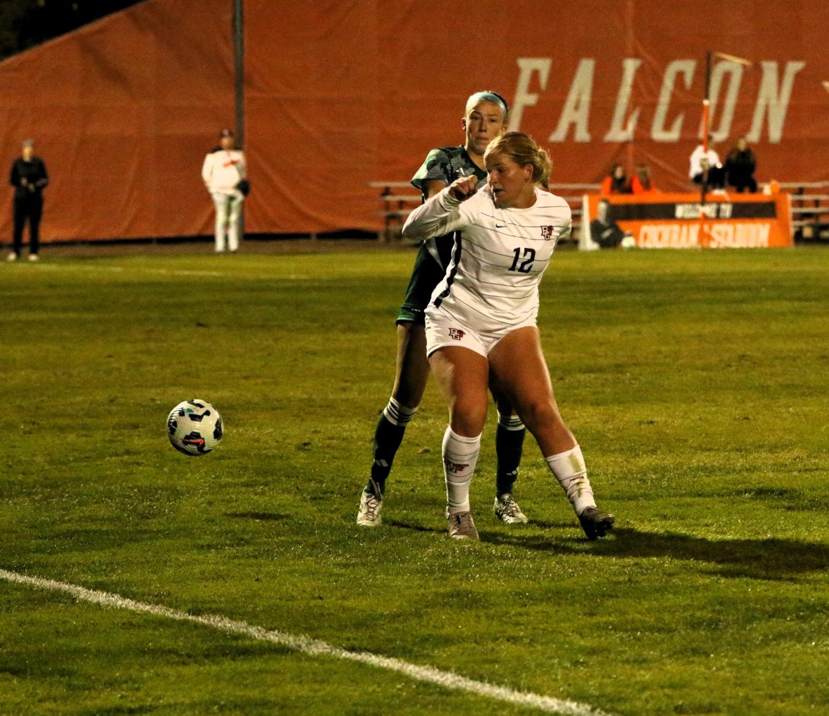 Bowling Green, OH - Falcons red shirt sophomore forward Alaina Uncapher (12) trying to get around an Eagles defender at Cochrane Stadium in Bowling Green, Ohio.